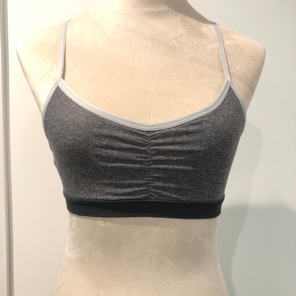 Gray, black and white colorblock sports bra.